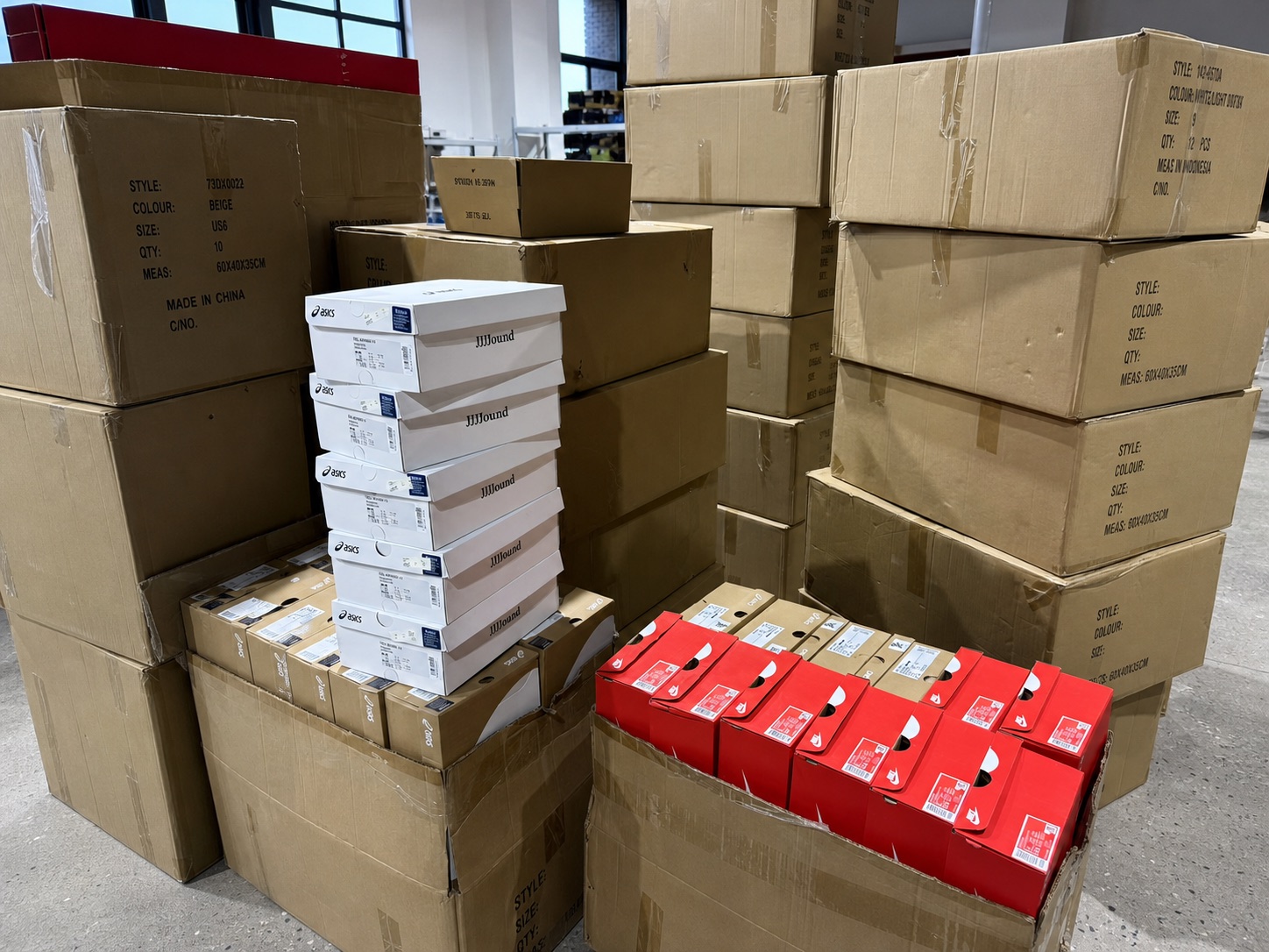 Footwear cartons organised for wholesale order fulfilment